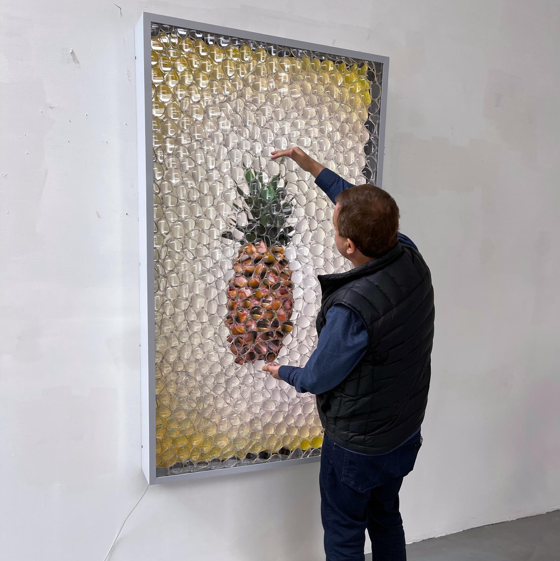 A mosaic of eyeglass lenses, Datuna's signature finish, is layered atop a fruit painting. 